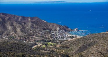 Image of bright blue water and mountains.