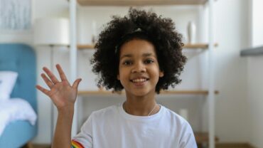girl waving