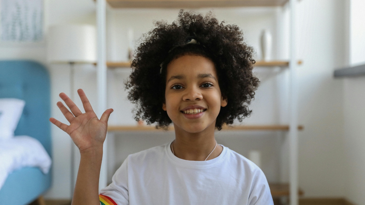 girl waving