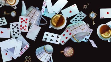 Alice in Wonderland theme cards teapot teacup clocks